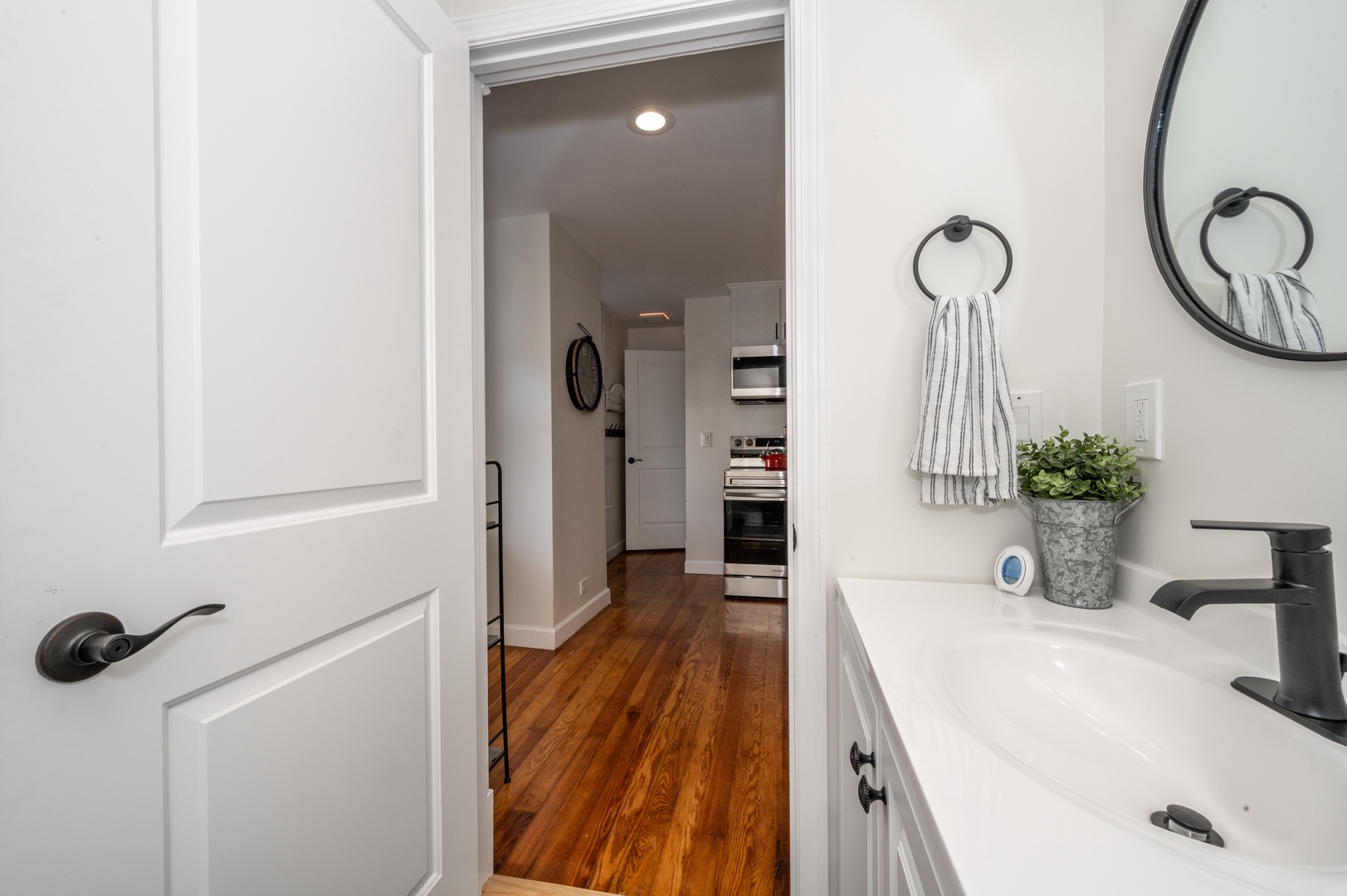 The sleek full bath in Apartment B features a single vanity & shower