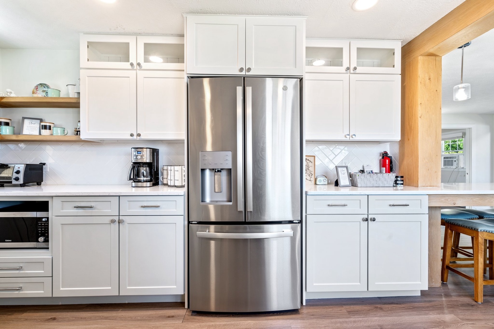 The cozy kitchen offers ample space & all the comforts of home