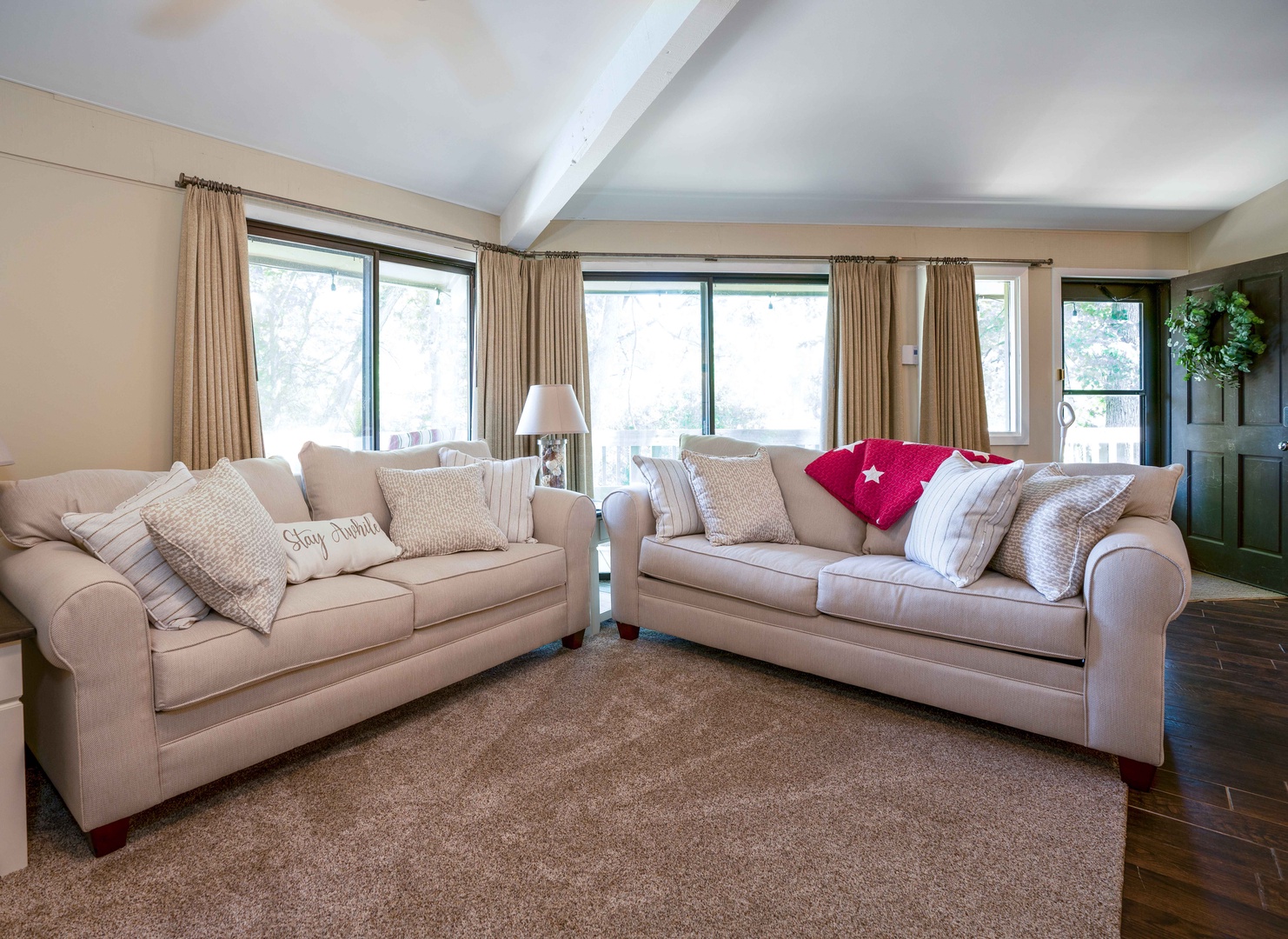 Bright living area with comfy seating and Smart TV