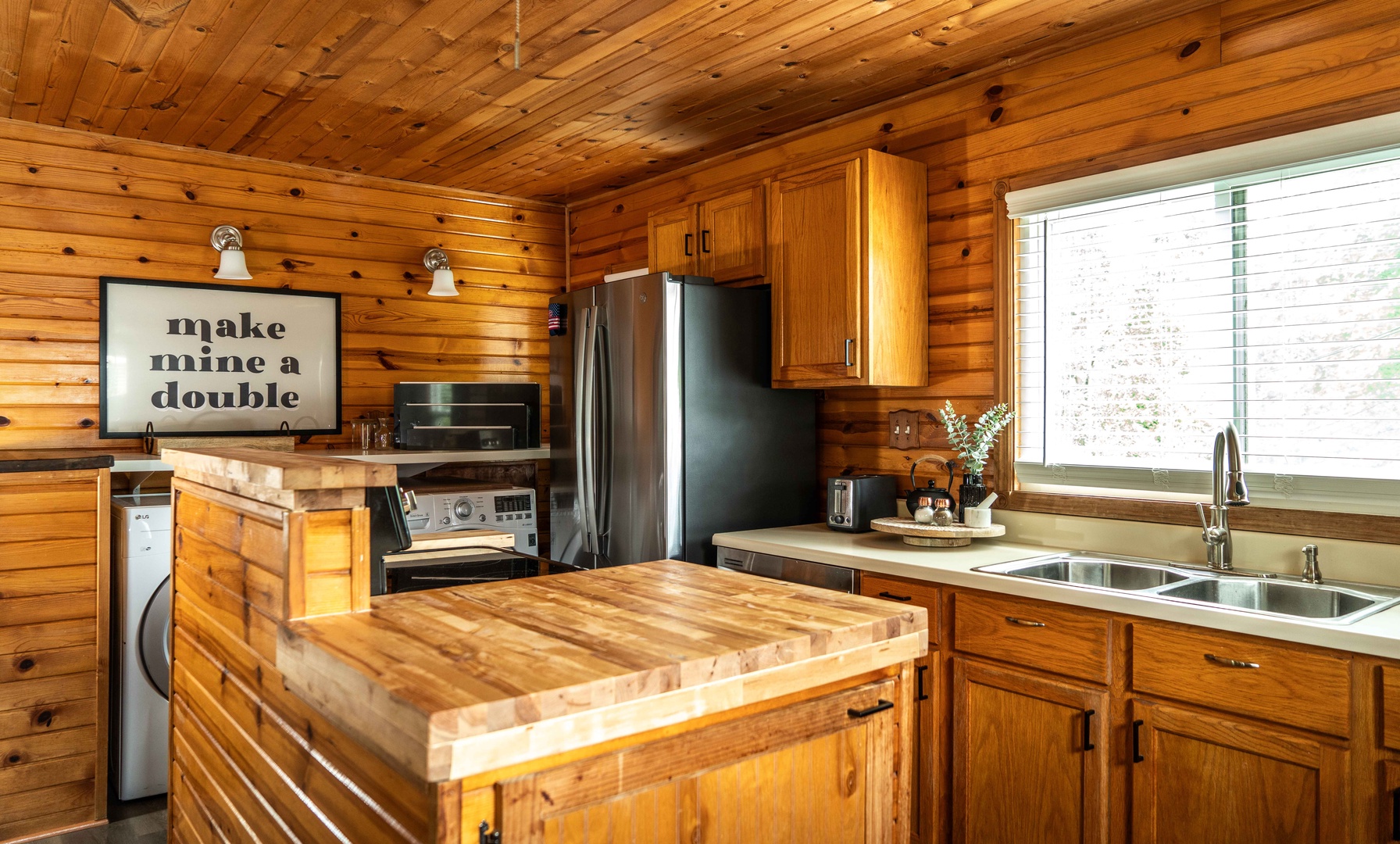 The welcoming kitchen offers ample space & all the comforts of home