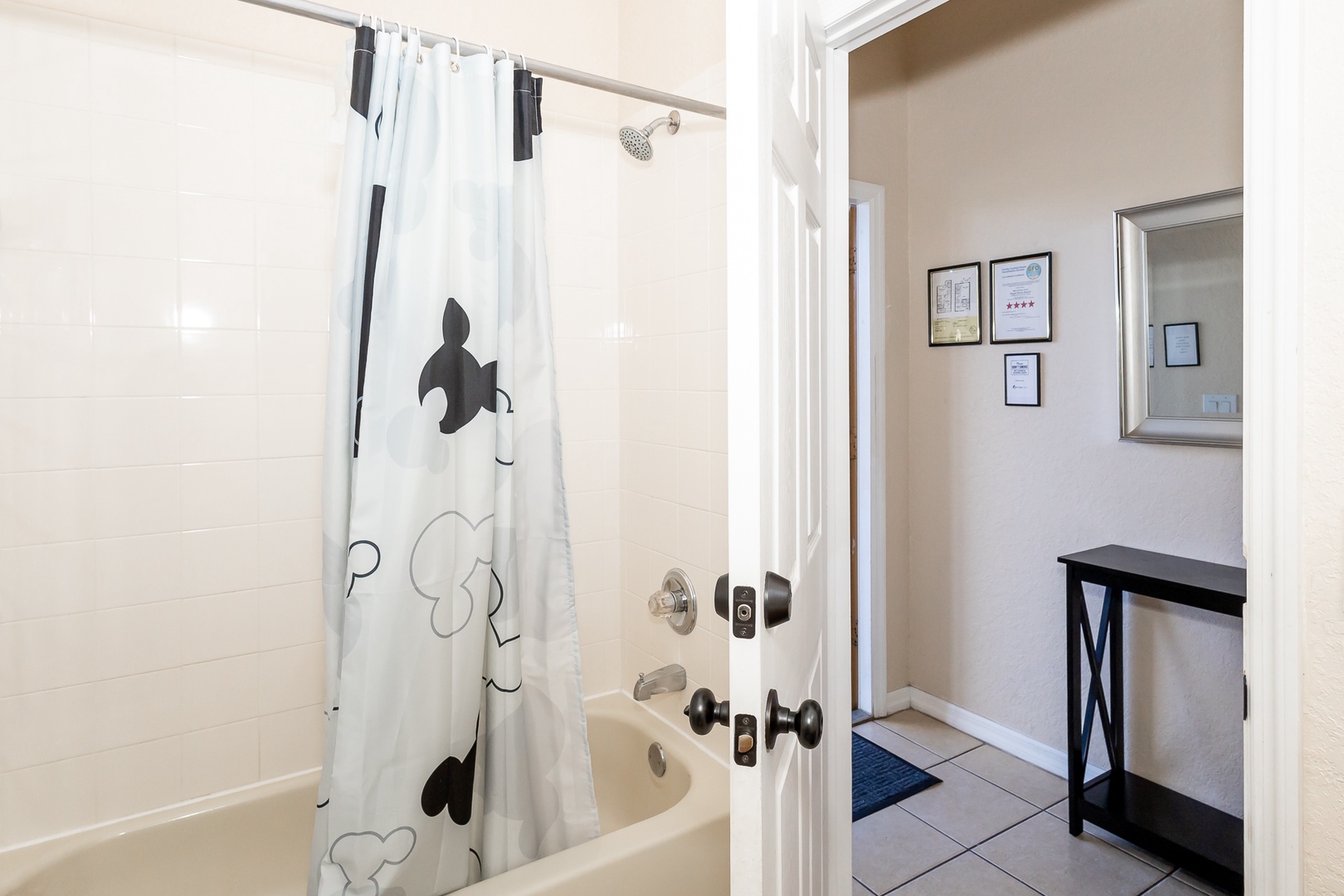The 1st floor en suite bathroom includes a single vanity & shower/tub combo