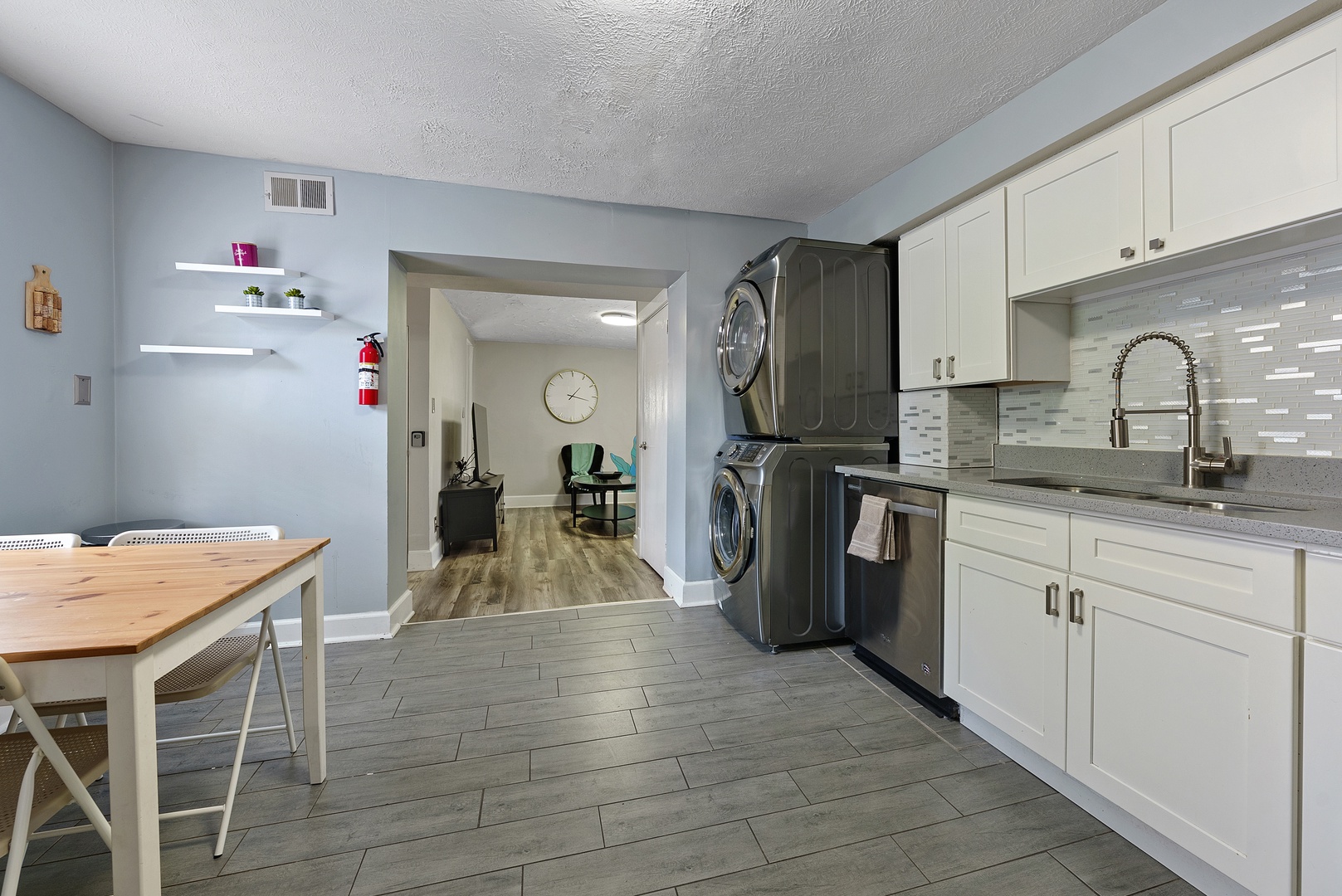 The airy eat-in kitchen offers ample space & all the comforts of home