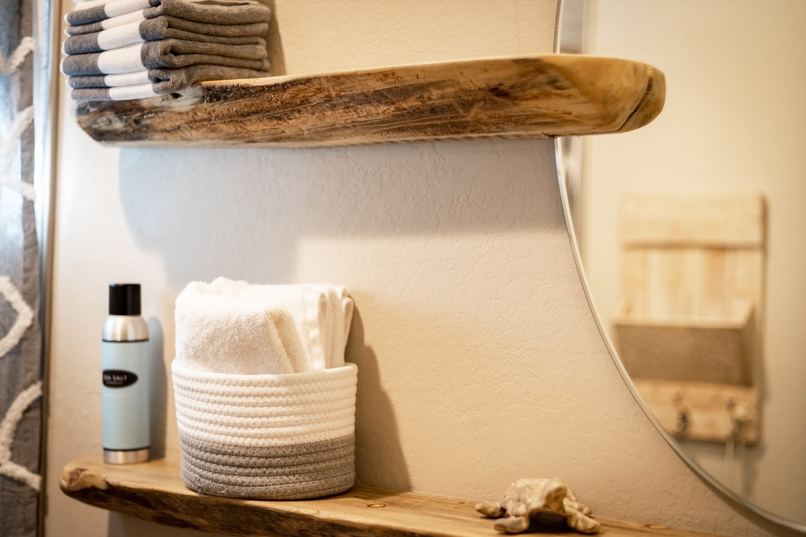 The main-level full bathroom includes a single vanity & shower/tub combo