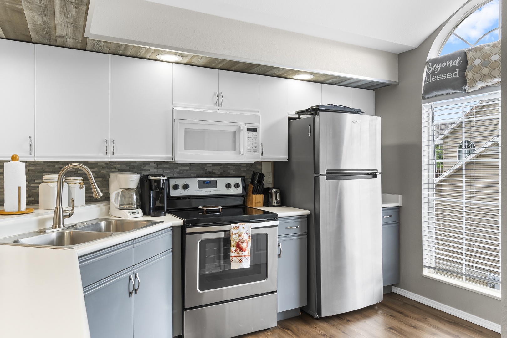 The open, airy kitchen offers ample space & all the comforts of home