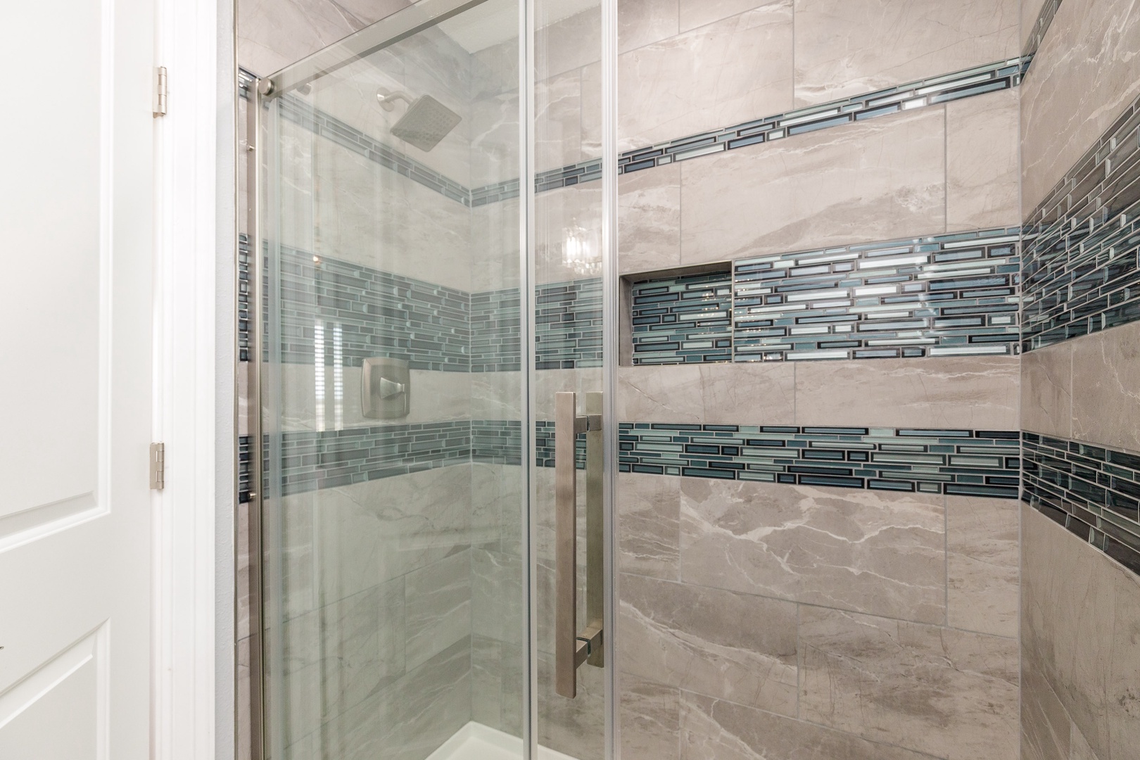 The king en suite bathroom includes a single vanity & glass shower