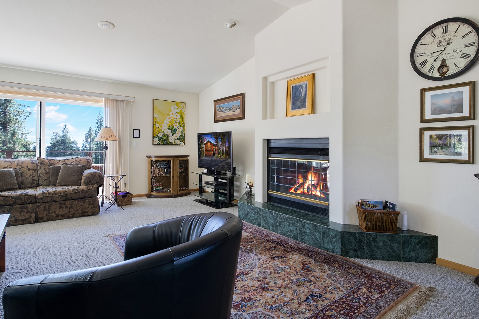 Bright living space with ample seating, fireplace, and Smart TV