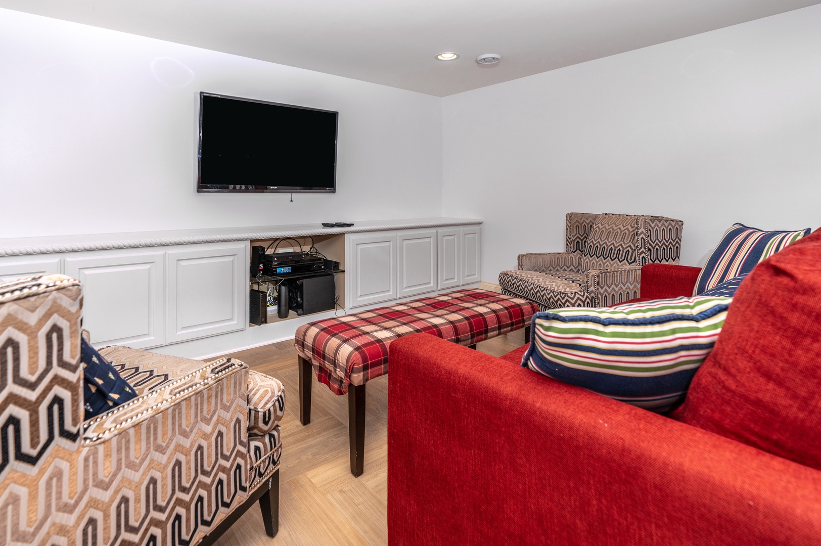 The lower-level family room is ideal for relaxing movie nights