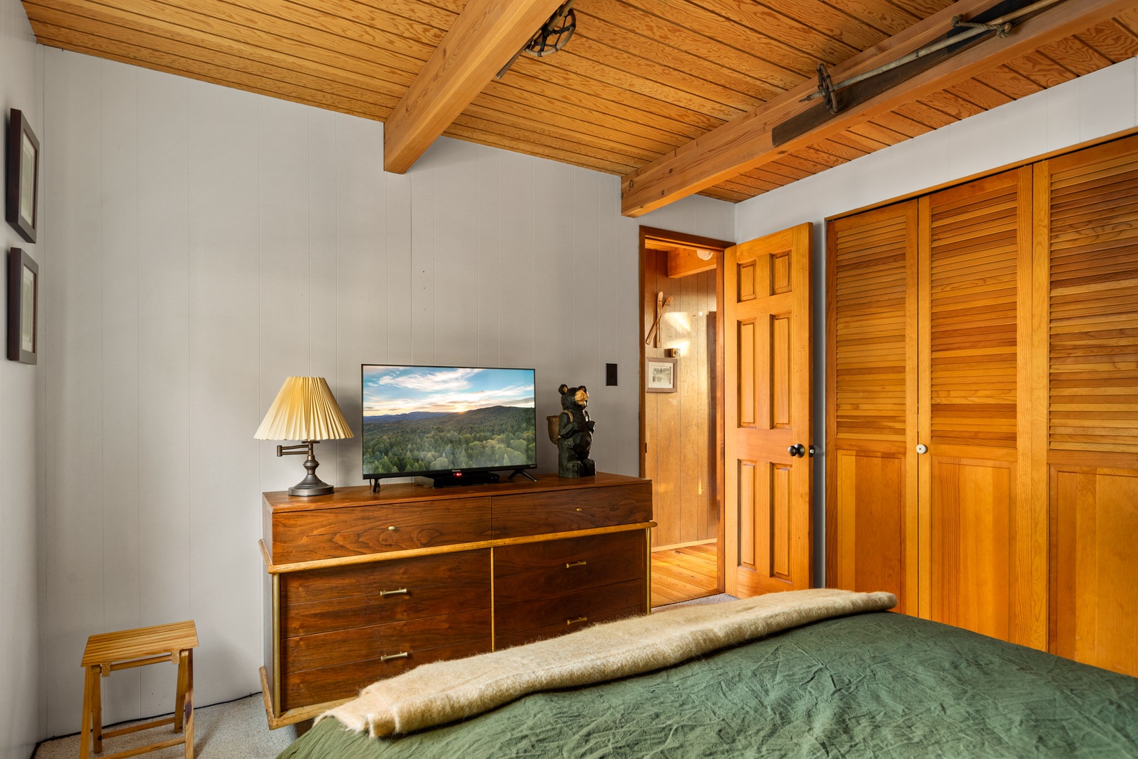 This main level bedroom retreat offers a full bed & Smart TV