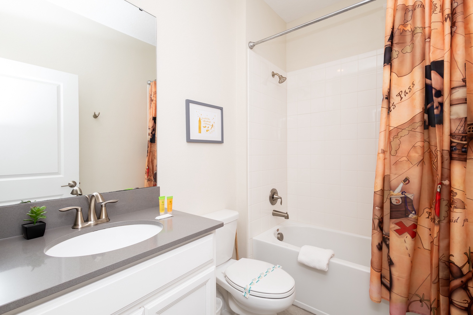 Wash up with this full bath’s single vanity & shower/tub combo