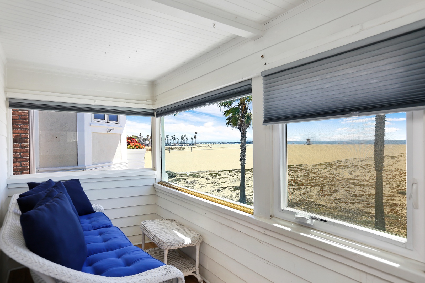Small enclosed patio overlooking the beach attached to bedroom #1