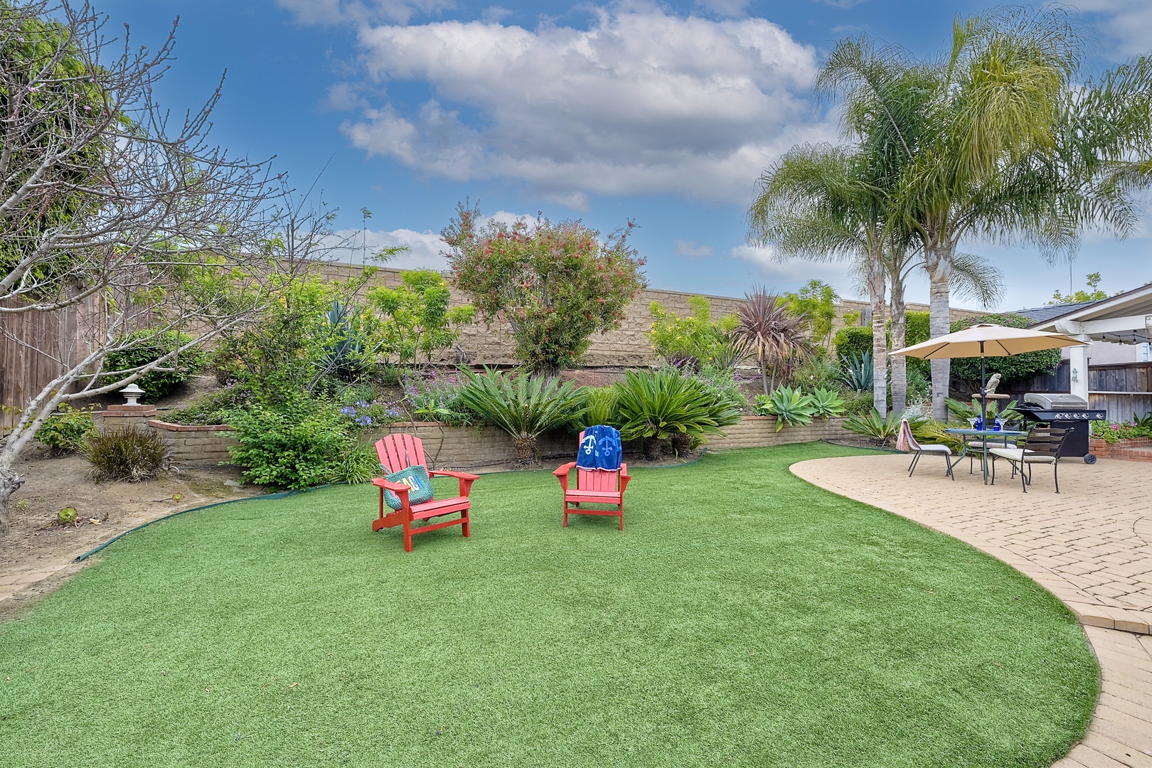 Experience serenity in the backyard oasis, ideal for gatherings & alfresco dining