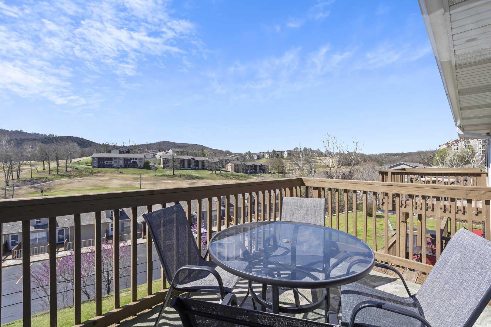 Golf course view from the deck with outdoor seating