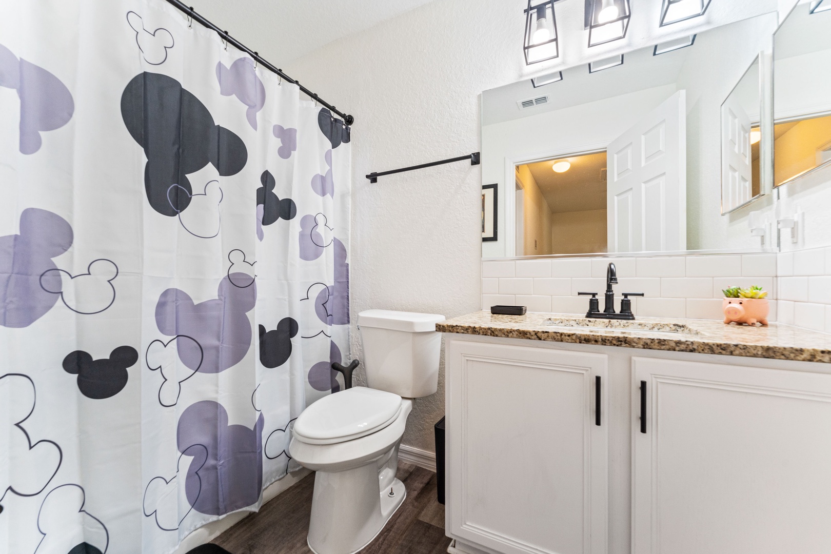 This hall bath features a single vanity & shower/tub combo