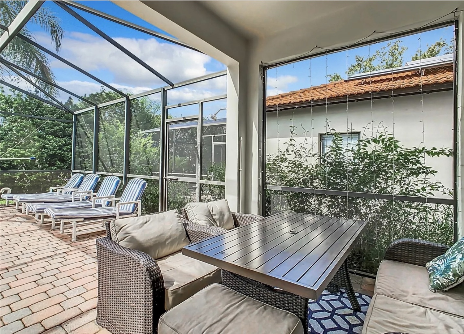 Private fenced in pool with outdoor seating