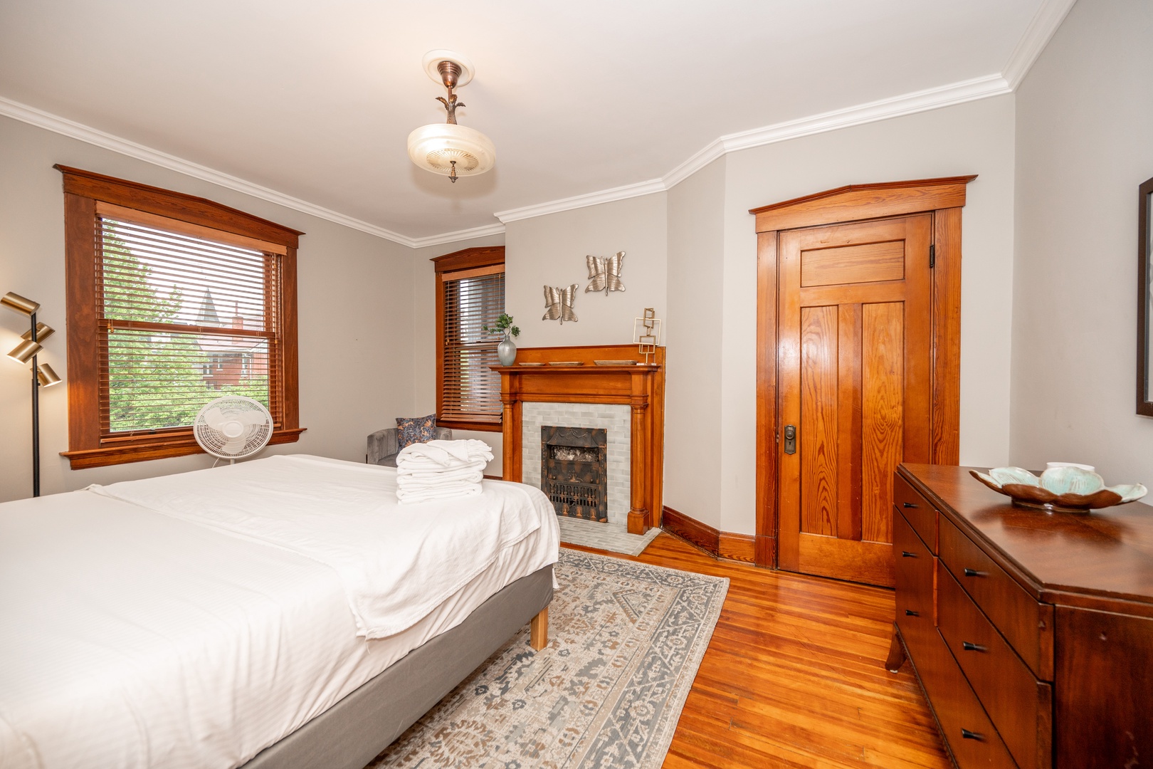 The second bedroom sanctuary features a cozy king-sized bed