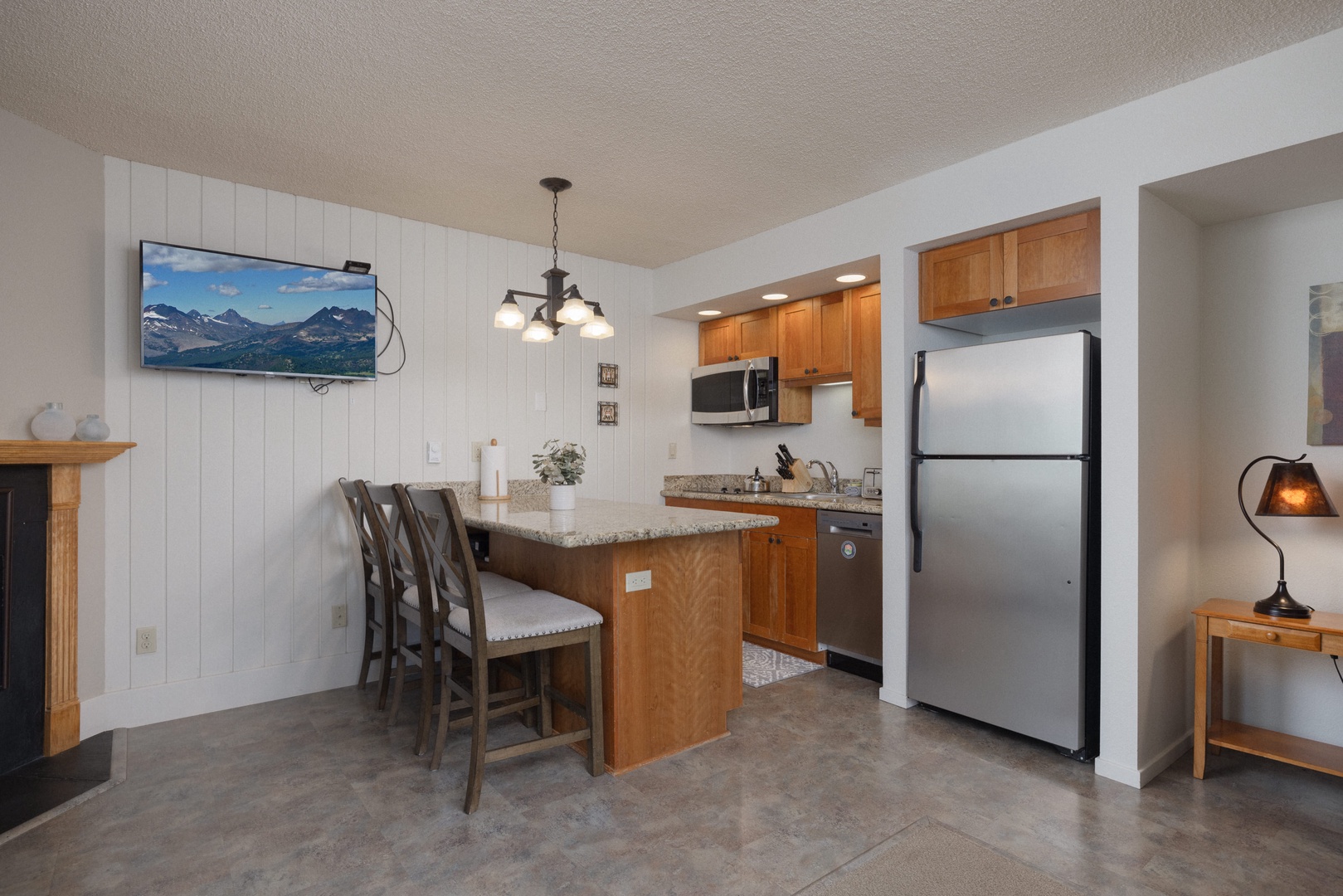 Counter seating for 3 and kitchen