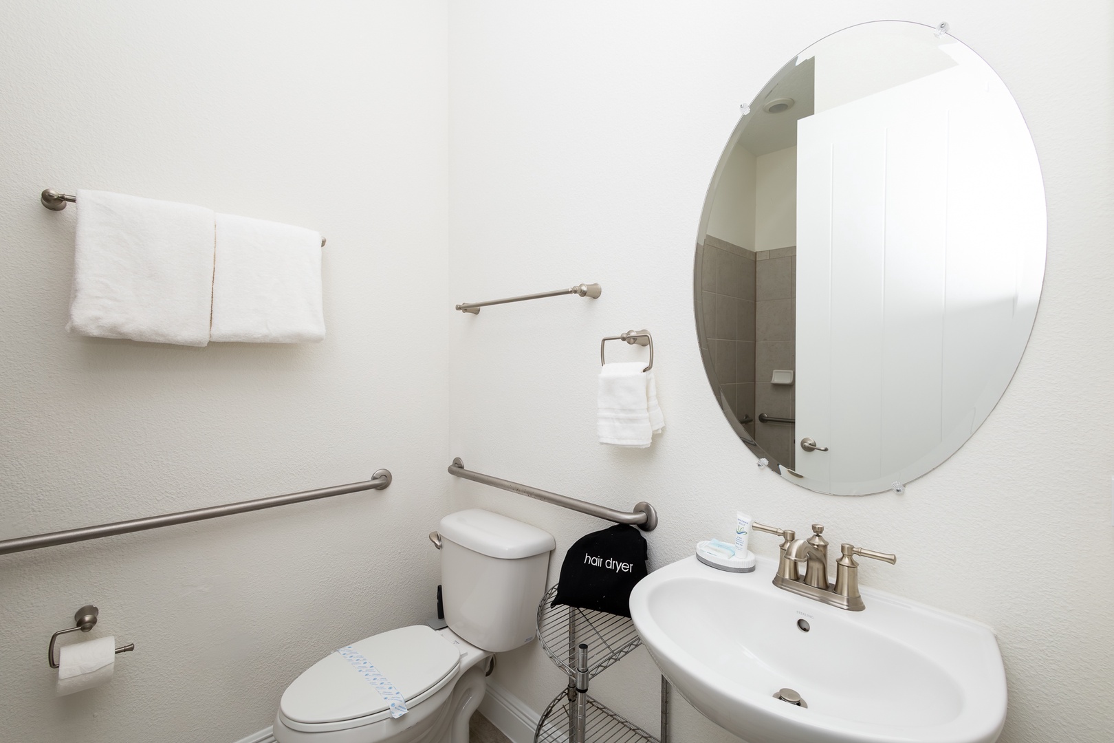 Wash up in this first floor handicap accessible ensuite, featuring a single vanity & roll-in shower