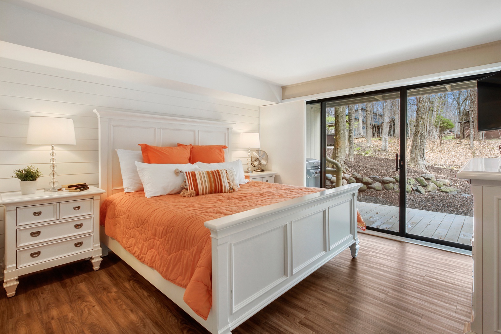 This bedroom sanctuary features a luxurious king-sized bed and deck access.