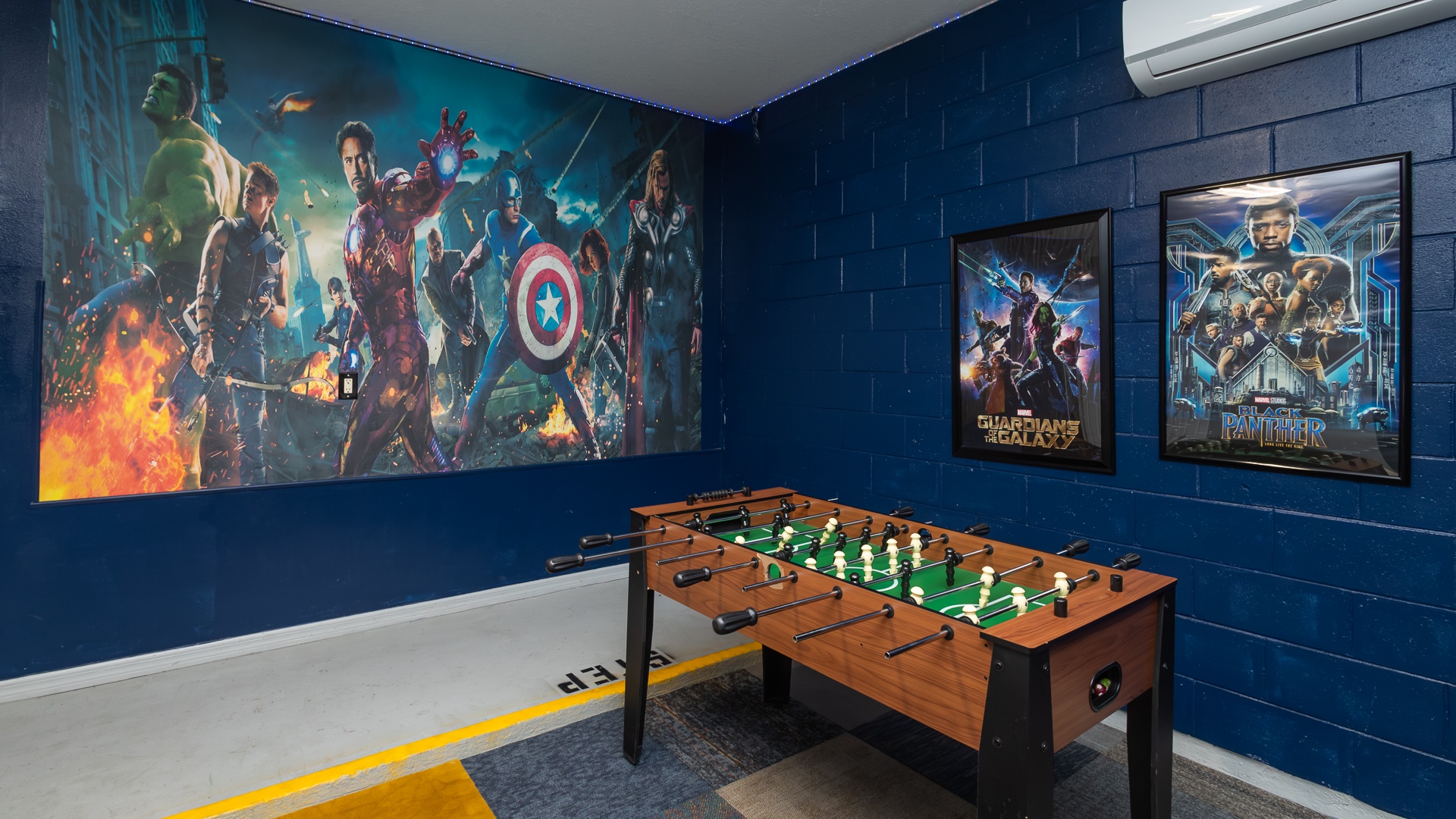 Marvel-themed game room fun: Pac-Man, foosball, and ping pong