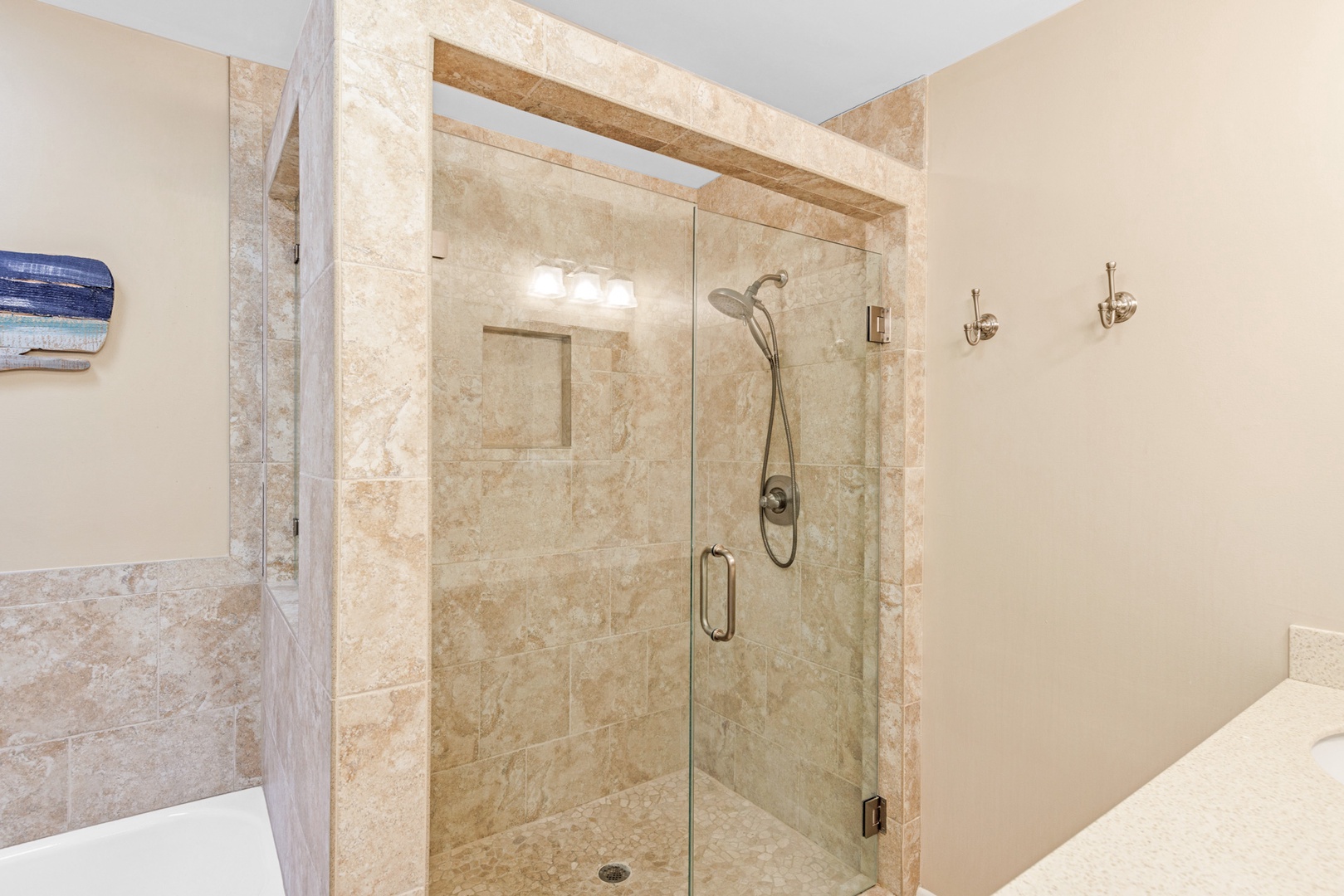 The second bedroom ensuite offers a double vanity, shower & separate tub