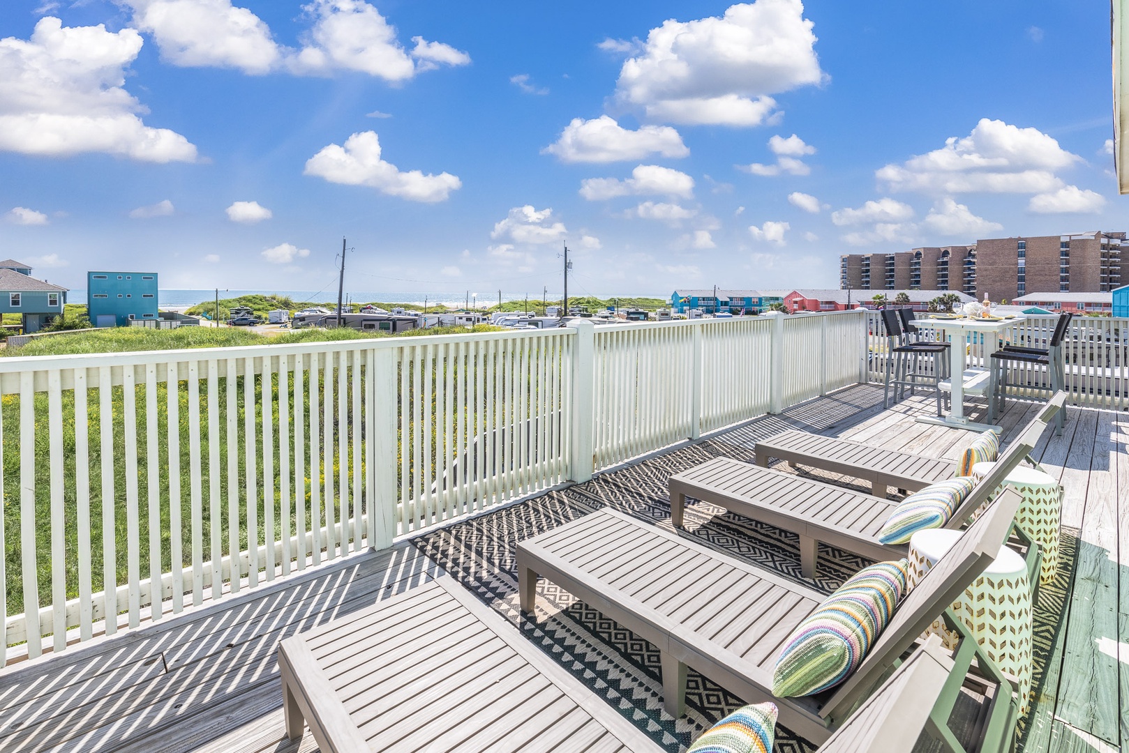 The 3rd Level Deck boasts sweeping area views and plenty of spaces to relax and dine