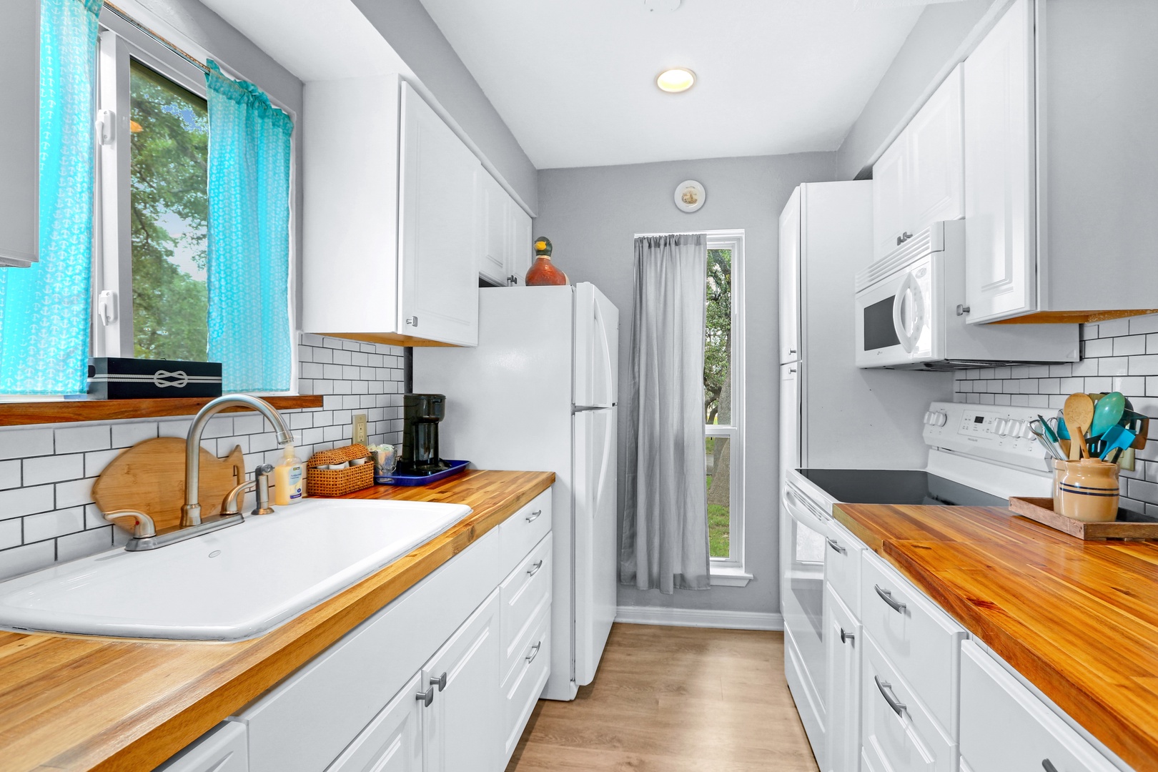 The open, airy kitchen offers ample space & all the comforts of home