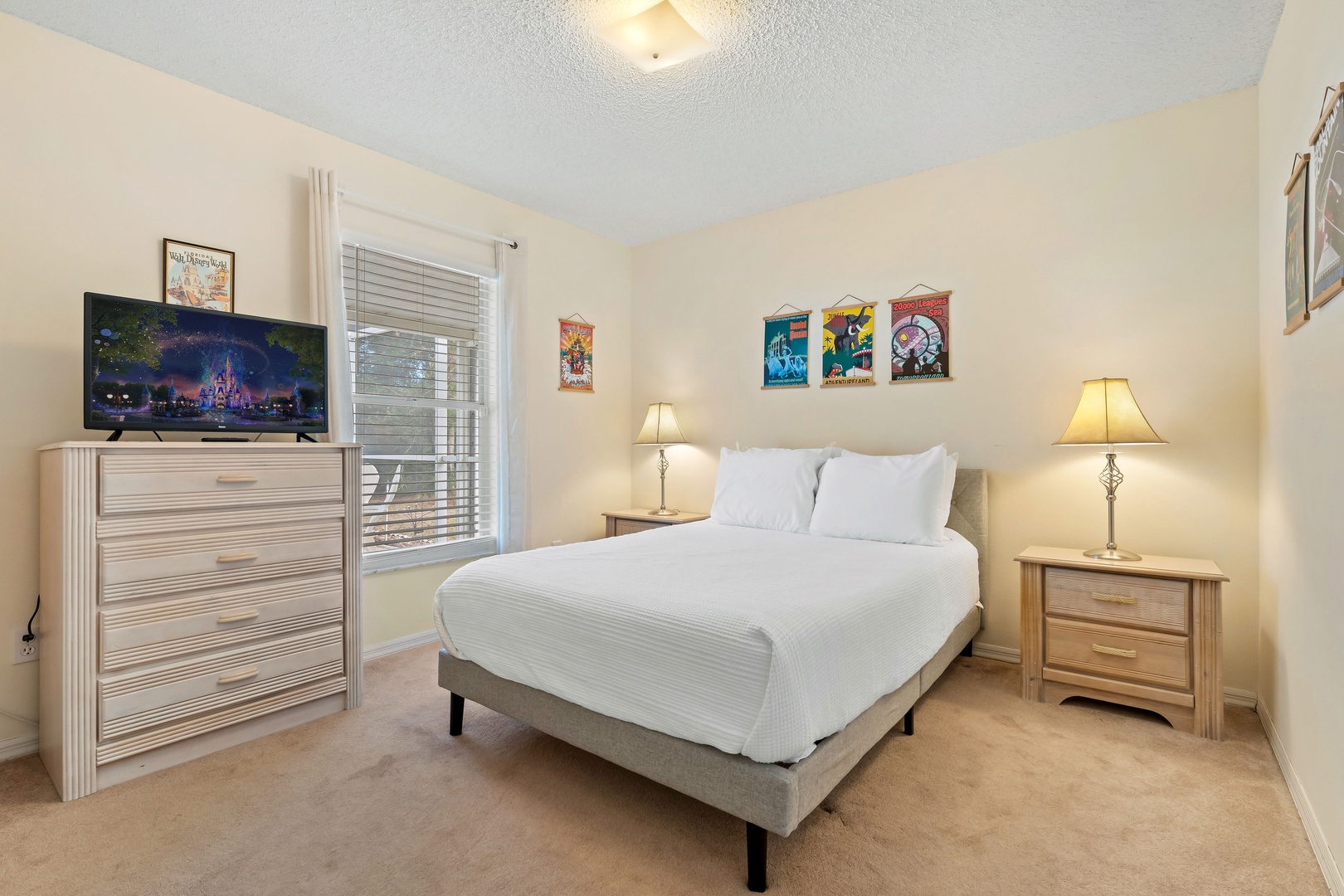 Unwind in this spacious full-size bedroom featuring a smart TV