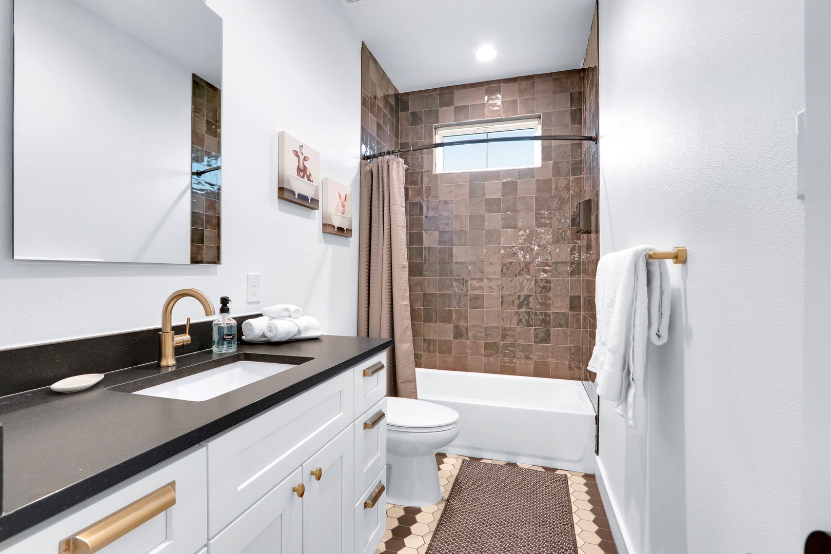 On the 2nd floor, this shared full bath offers a single vanity & shower/tub combo