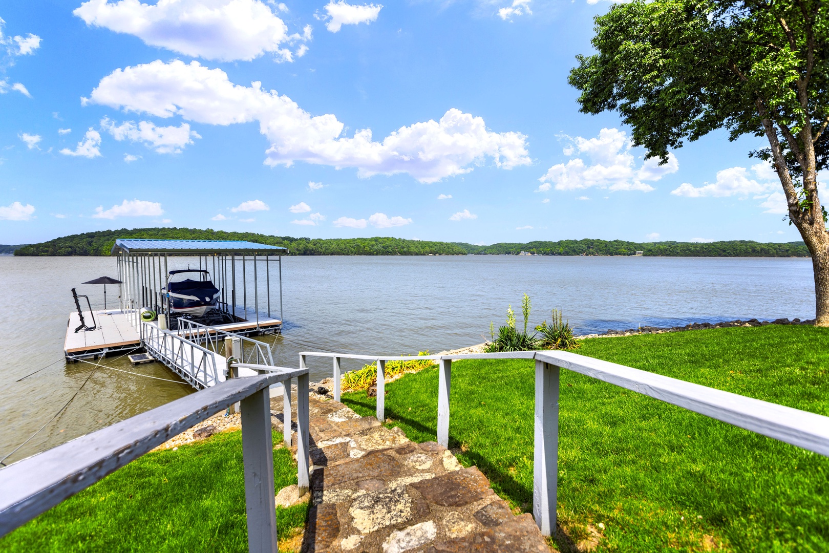 Stairs leading down to dock area, boat slip is not available for guest use