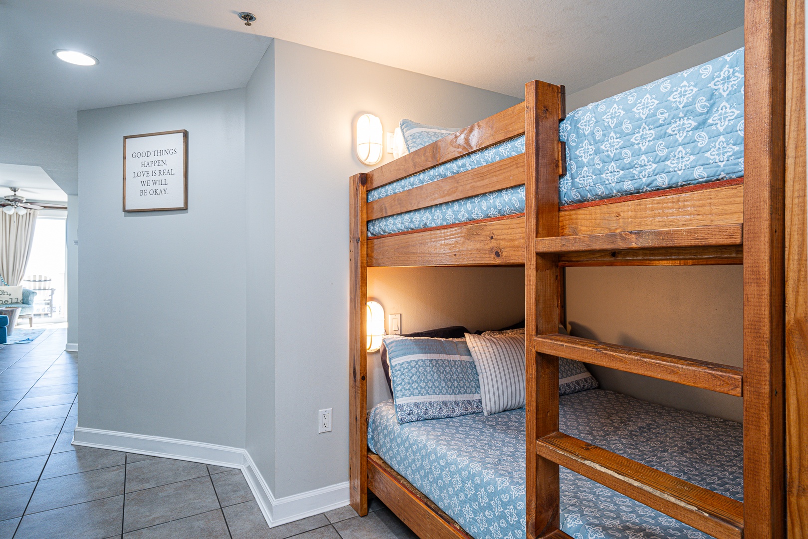 A multifunctional entryway with laundry and a cozy bunk bed nook
