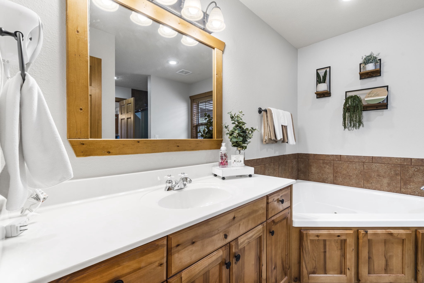 En-Suite Bathroom featuring ample counter space and separate Shower/Soaking Tub