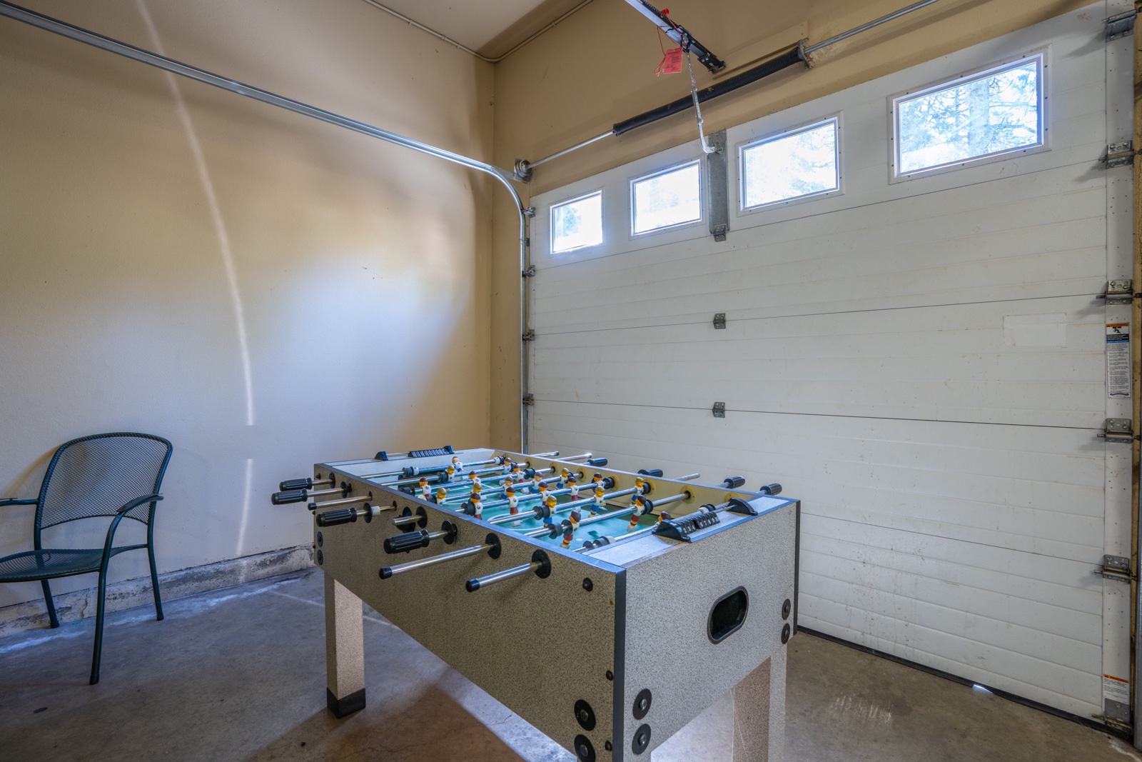Unleash your competitive side with pool & foosball in the garage game area