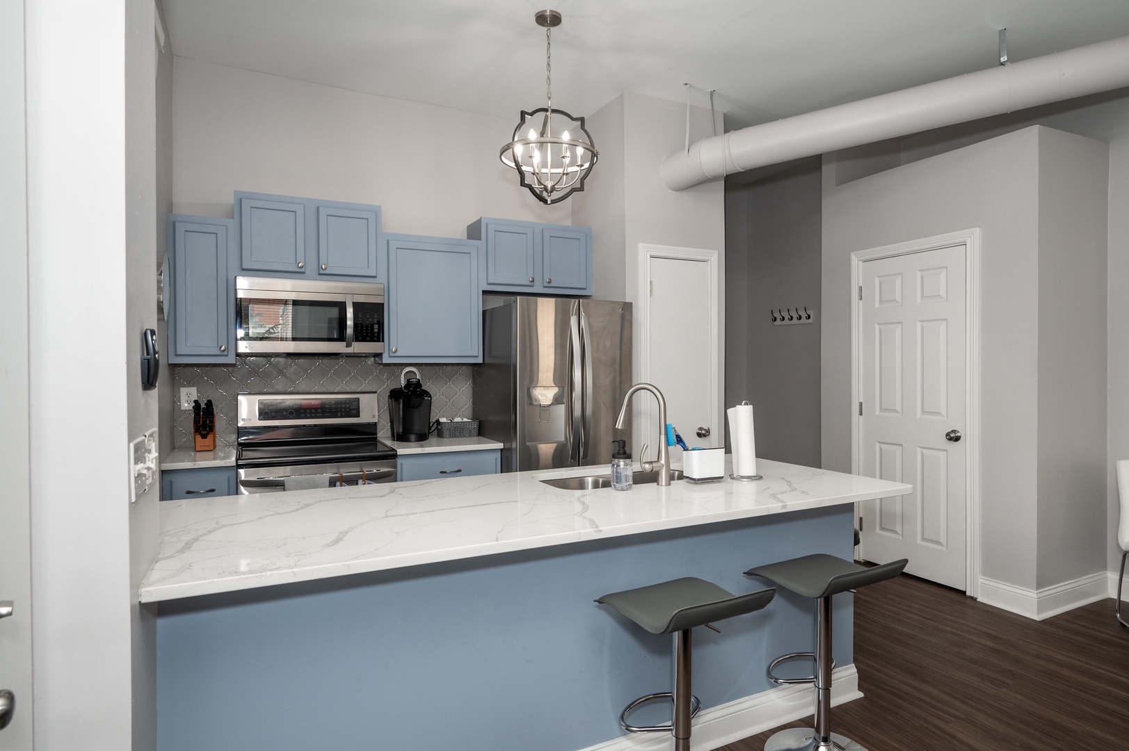 Apt 3 – The sprawling kitchen counter offers additional seating for 2
