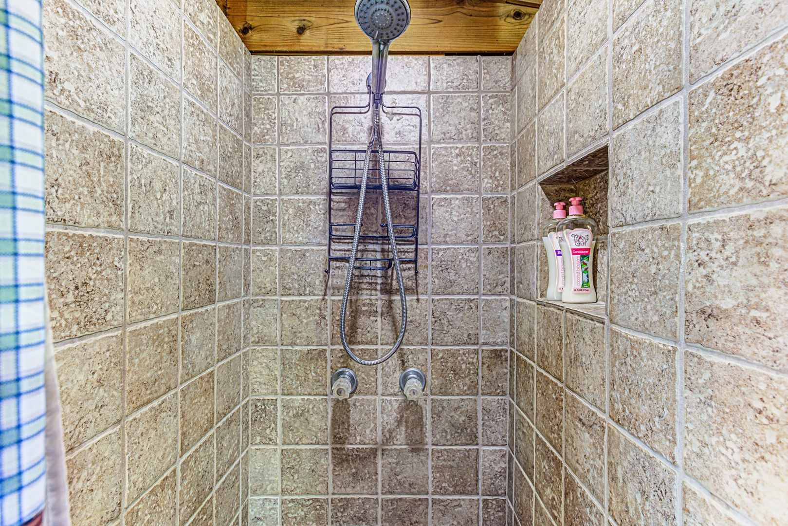 The full bath offers a pedestal sink & walk-in shower
