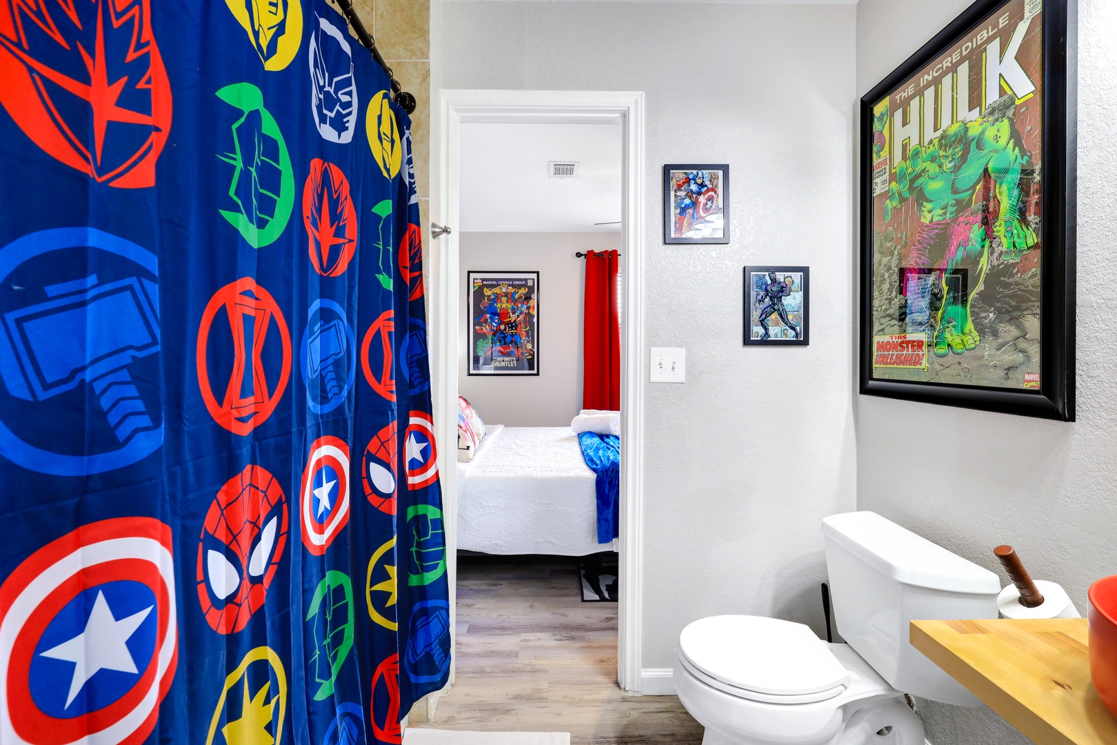 The 2nd-floor Jack & Jill bathroom offers a single vanity & shower/tub combo