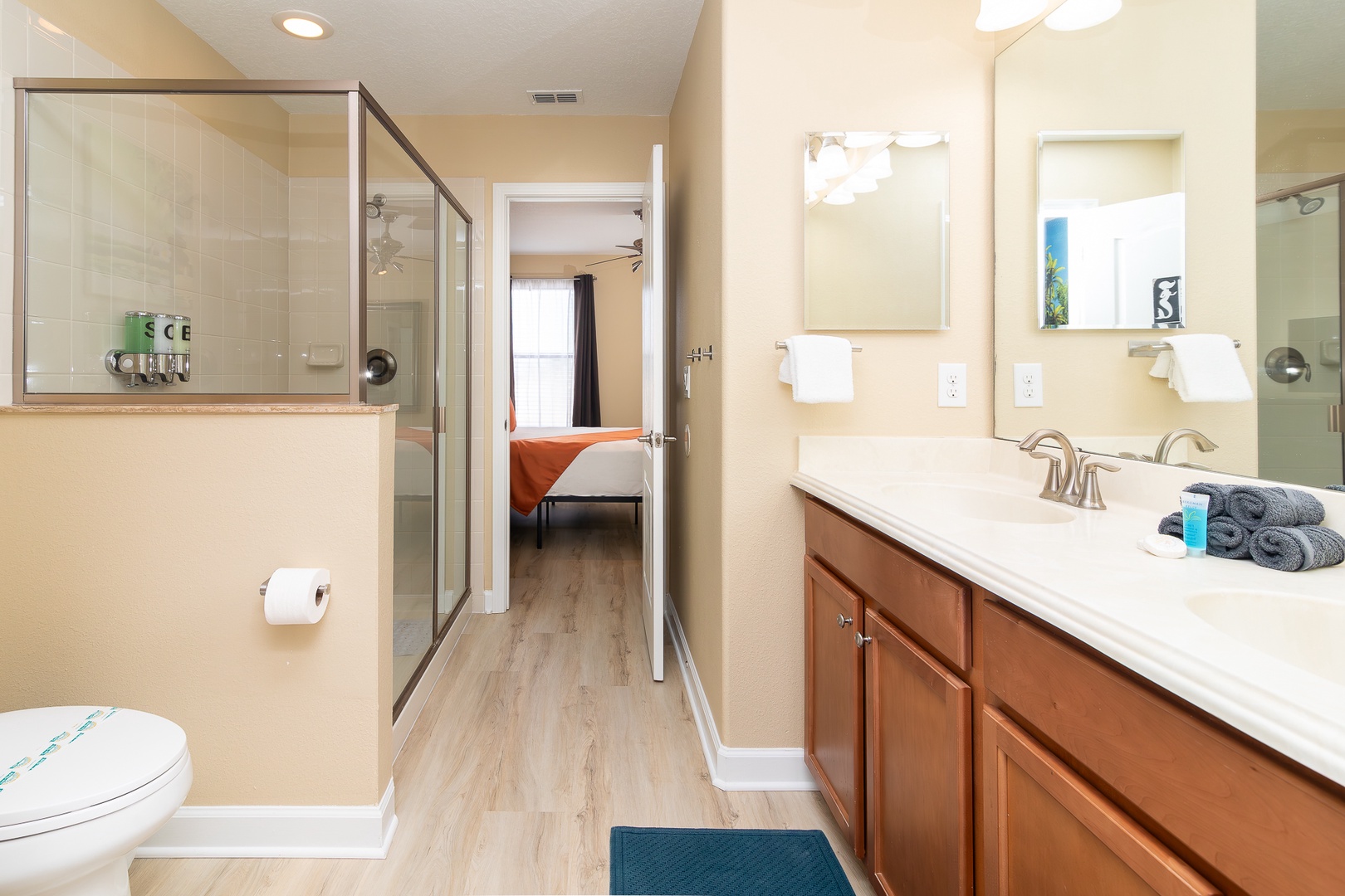 This Jack & Jill ensuite features a double vanity & glass shower