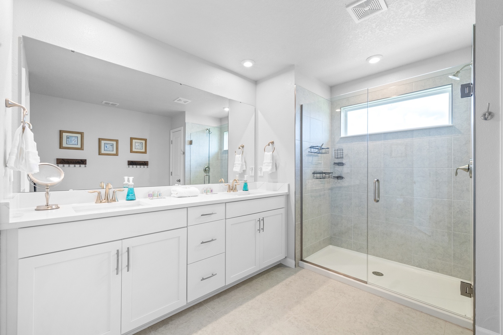 The master ensuite features a luxurious spa-like glass shower