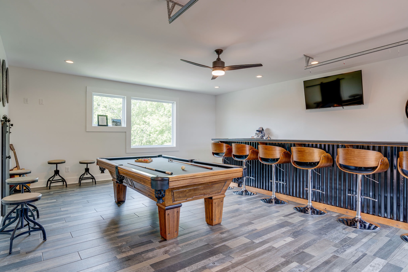 Game room with pool table and TV