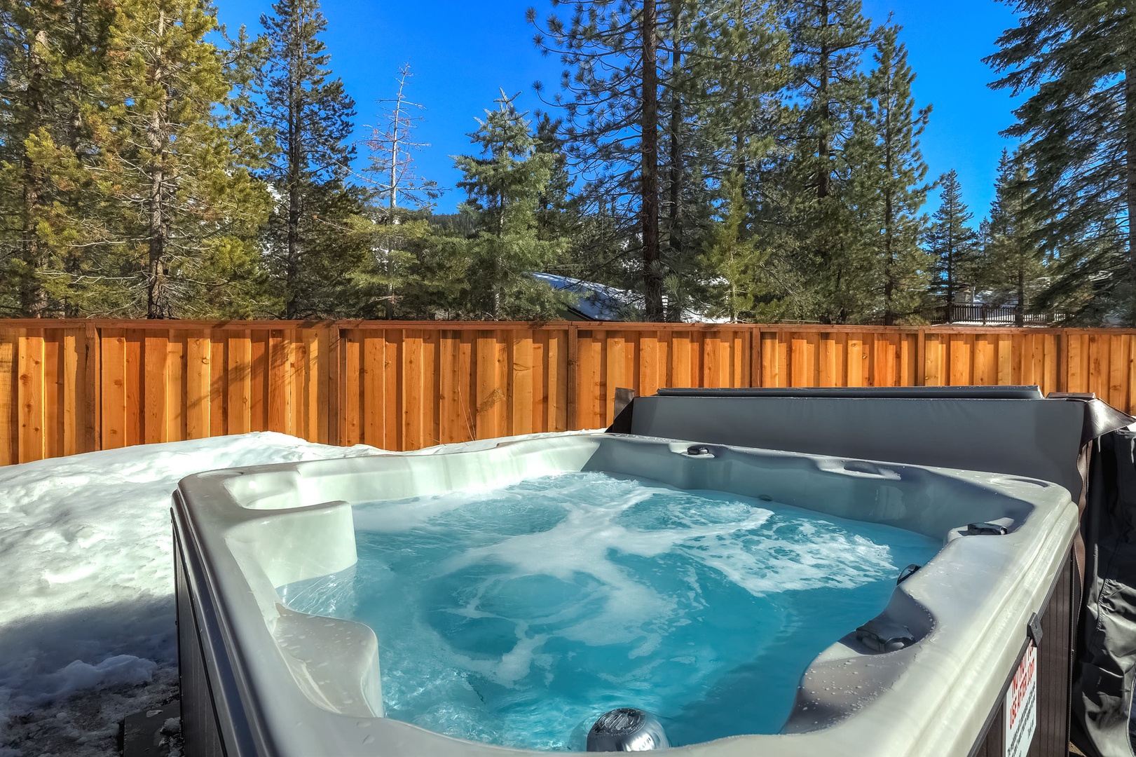 Private outdoor hot tub in backyard