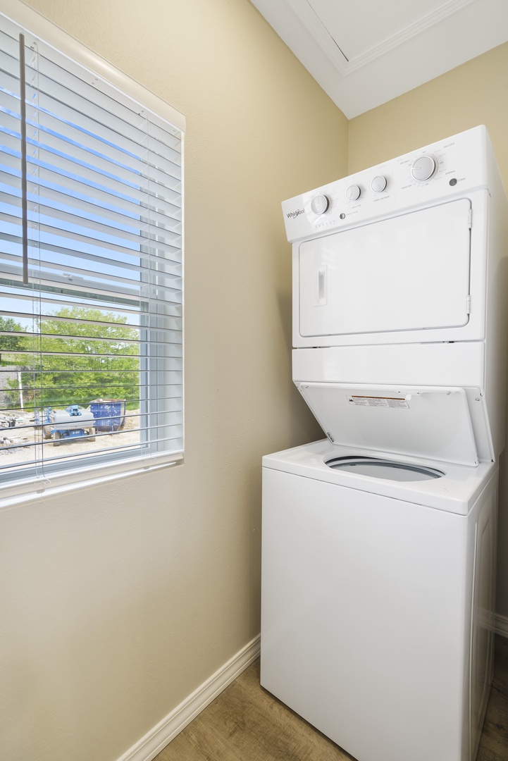 Stackable washer and dryer off of the kitchen