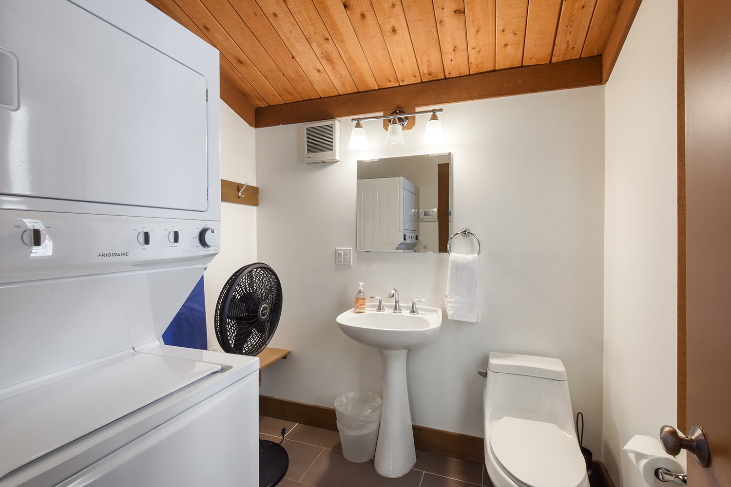 Half bath with stackable washer & dryer