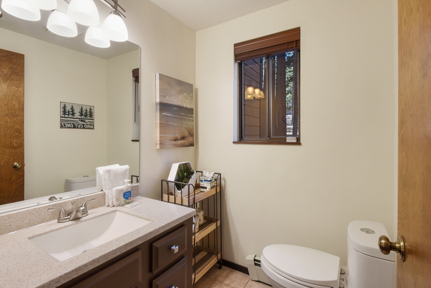 Unit #2: A convenient half bathroom is tucked away off the dining area
