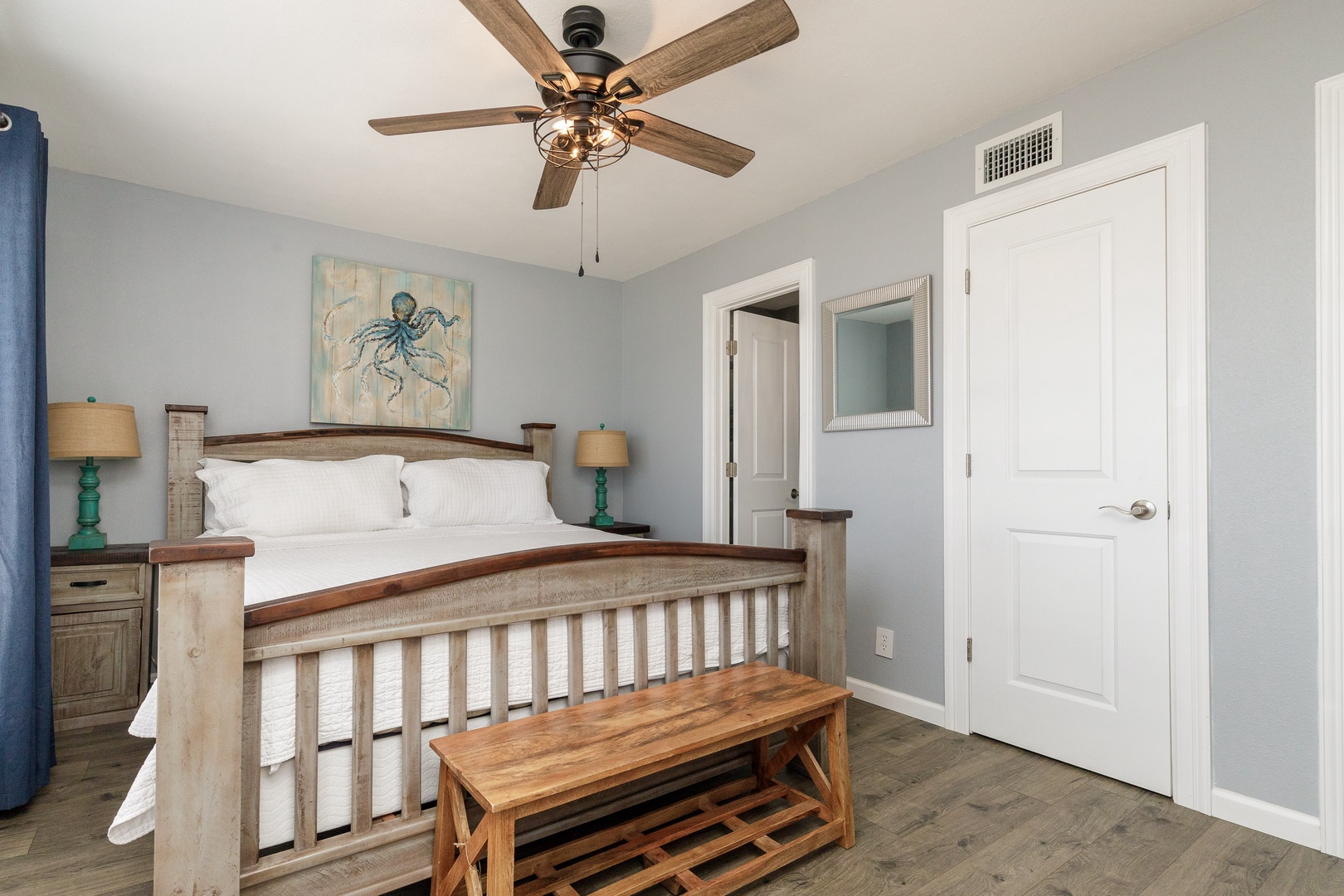 This king suite boasts a private en suite, Smart TV, & ceiling fan