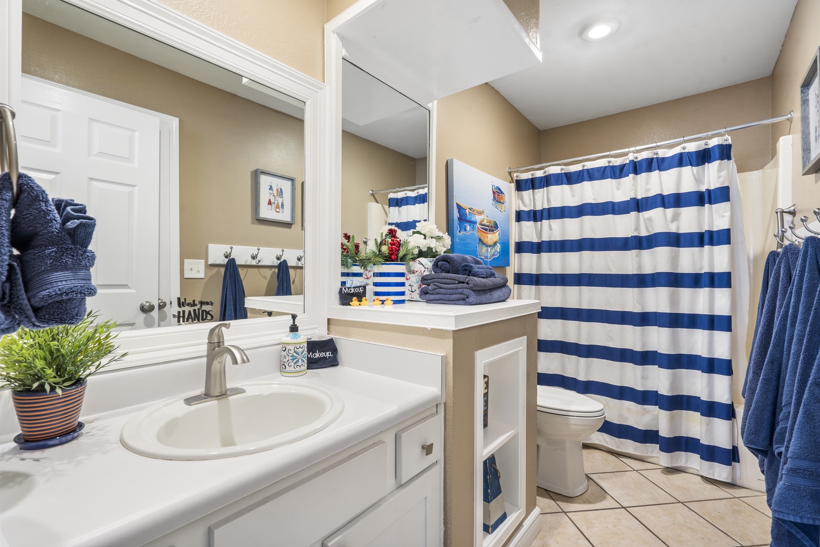 This ensuite links to the living area, featuring a single vanity & shower/tub combo