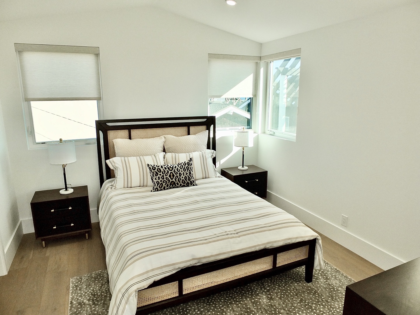 The 3rd-floor bedroom sanctuary offers a cozy queen-sized bed