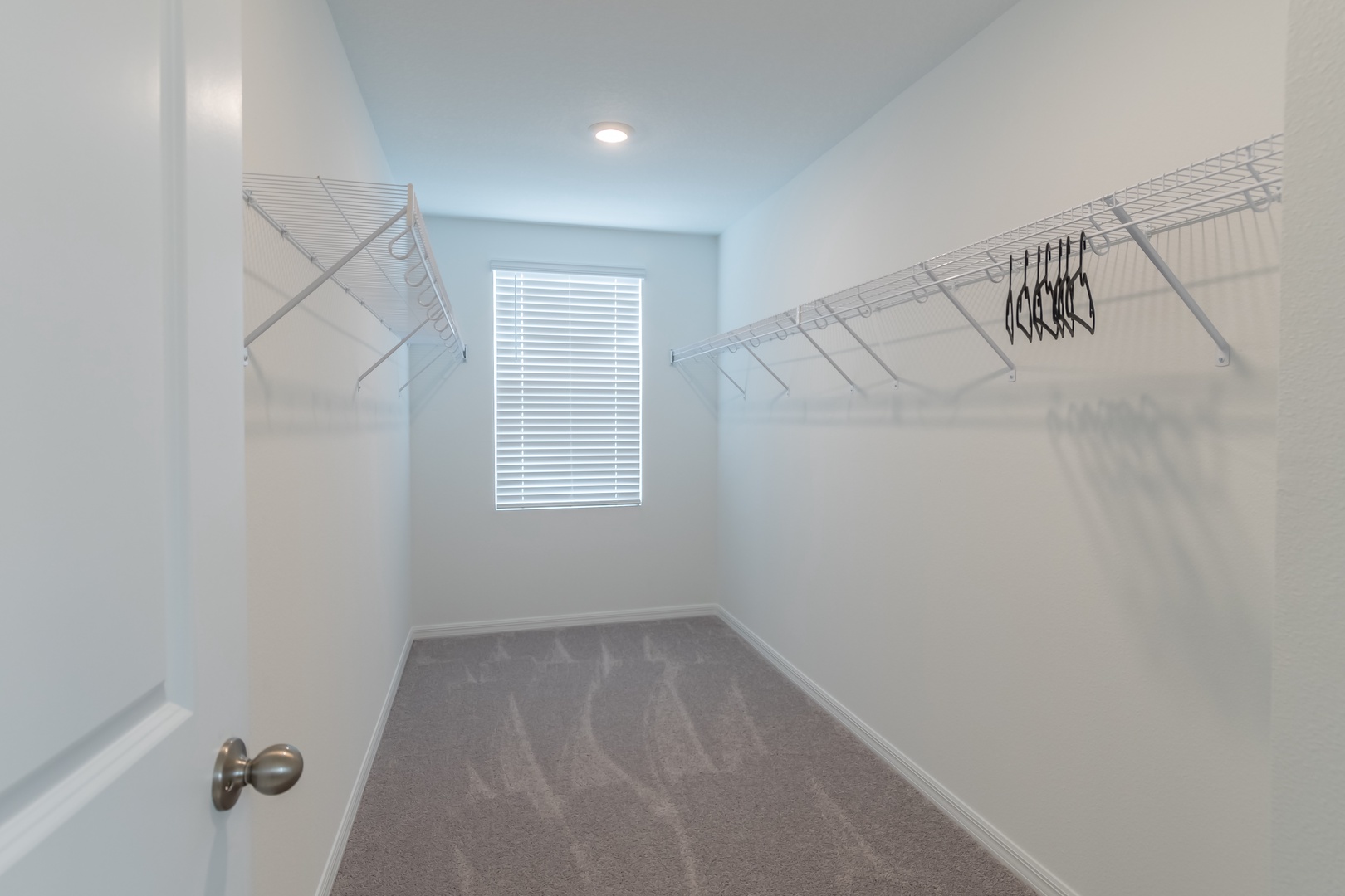 Keep clothes & bags tucked away in the spacious master closet