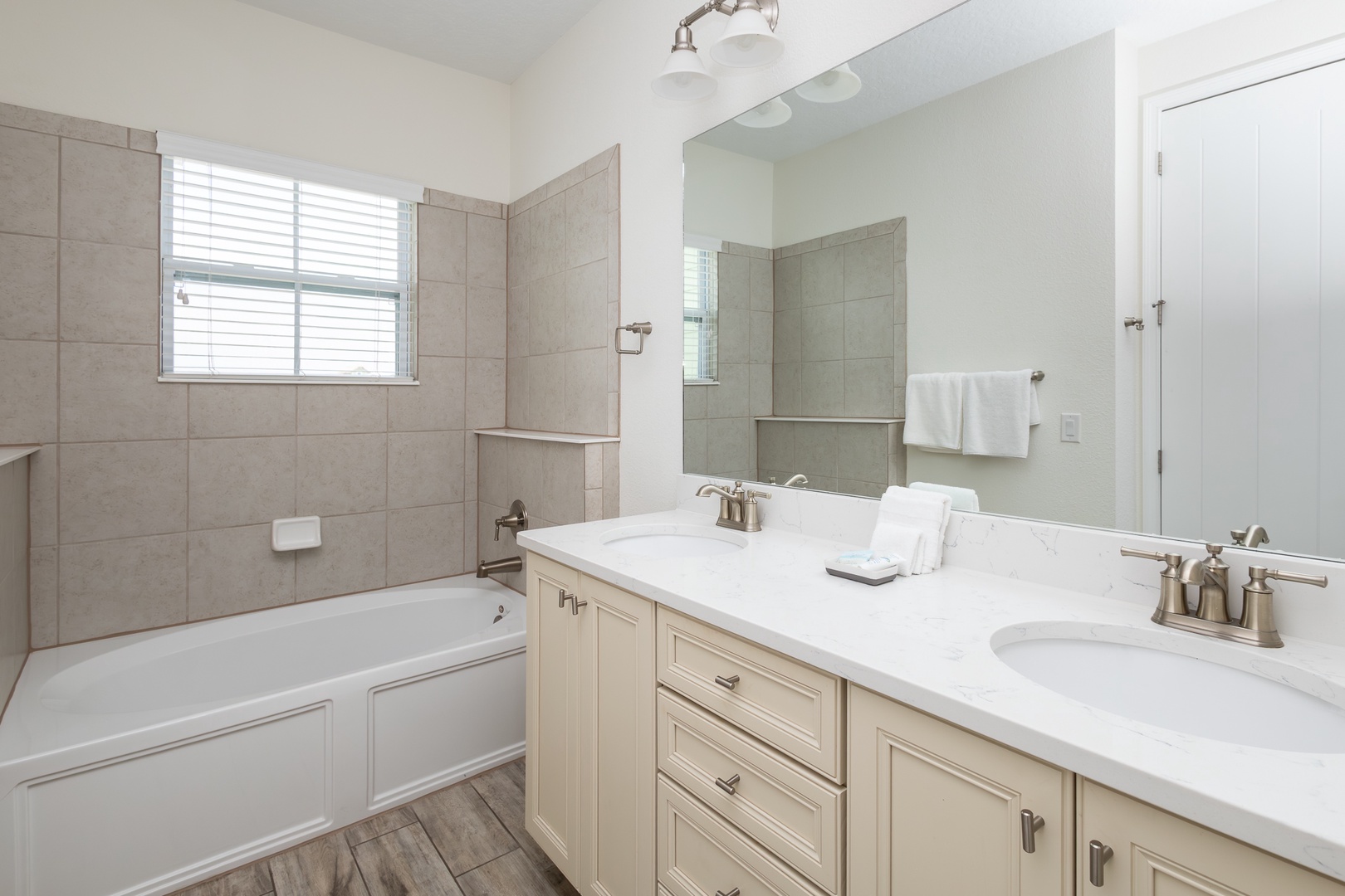 A double vanity & walk-in shower with separate oversize tub ensuite bath