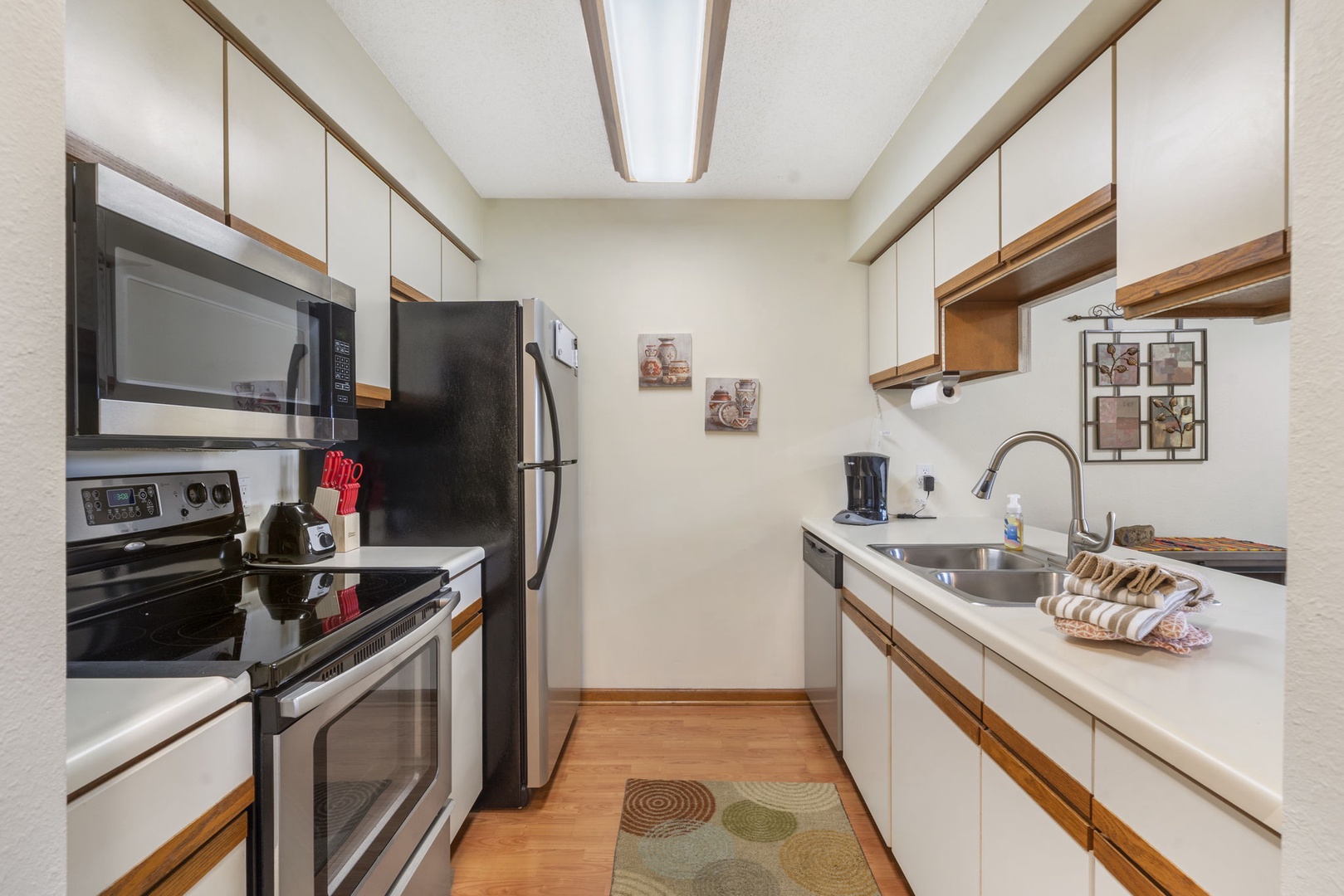 Head into the open kitchen, offering ample storage space & lots of amenities