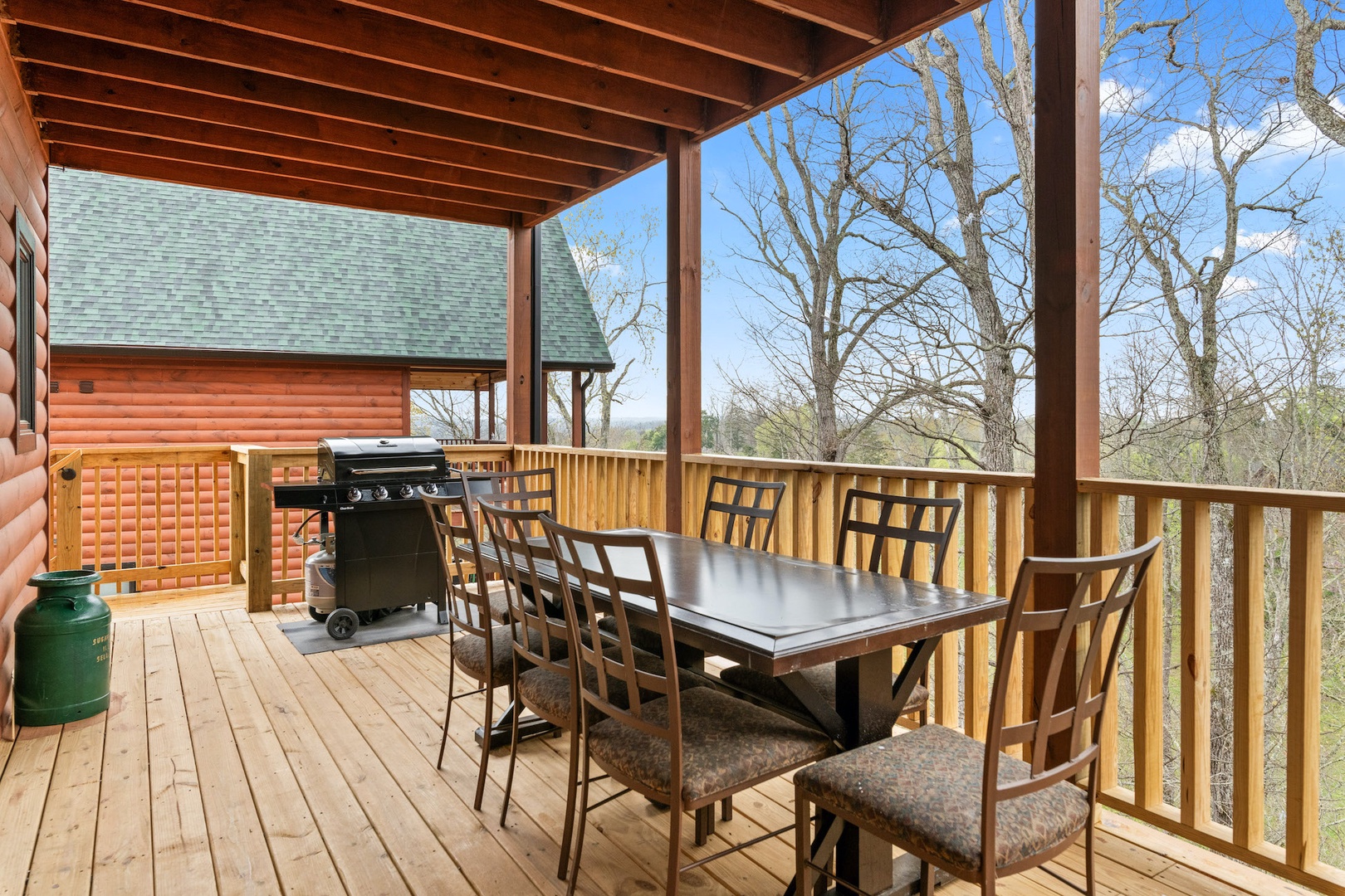 Back deck off of the kitchen with drill and outdoor seating