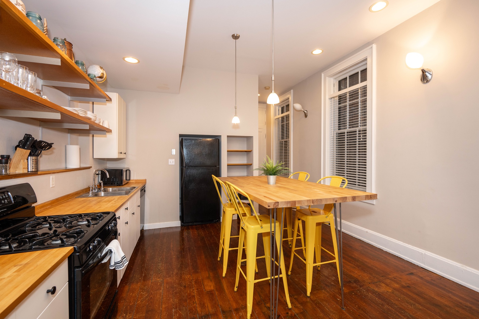 The chic eat-in kitchen offers ample space & all the comforts of home